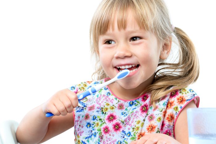 Young Children Brush Teeth